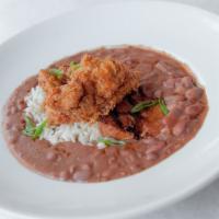 Red Beans And Rice  · Traditional red beans & rice served with an andouille sausage