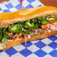 The Banh You · Shaved sirloin OR “No Evil Foods” plant meat. cucumbers, fresh jalapeños, Cilantro, Quick pi...