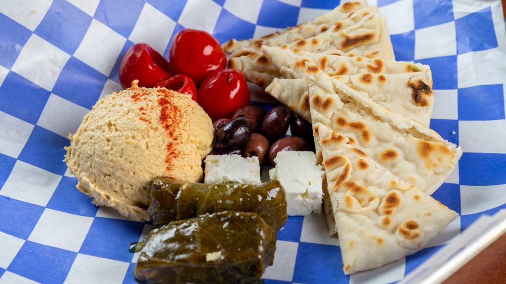 Go Big Or Go Homer · Scoop of Hummus served with Toasted Pita Points, Stuffed Grape Leaves, Kalamata Olives, Peppadew Peppers, and Feta Cheese