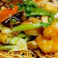 House Pan-Fried Noodle(三鲜两面黄) · Stir-fried with Shrimp, Beef and Chicken, mixed veggie, on top of pan-fried thin egg noodle.