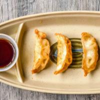 Fried Gyoza Dumplings · 4 pieces of chicken dumplings lightly fried, served with homemade dipping sauce.