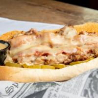 The Cuban Sandwich · Slow simmered tender juicy pulled pork, sliced ham, melted swiss cheese, zesty pickles, and ...