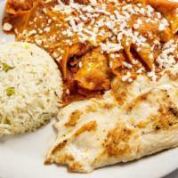 Chilaquiles Verdes O Rojos · Corn chips sautêed with green or red sauce served with white Mexican rice, fresh cheese, a p...