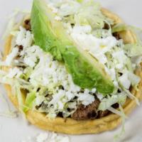 Sopes · Delicious thick corn tortilla topped with black bean, your choice of meat, lettuce, tomato, ...