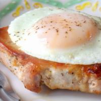 Pork Chops N Eggs · Grilled Pork Chops served with your choice of hash browns or grits eggs an toast.