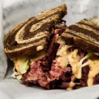 The Great Bambino · Corned beef and pastrami with chopped coleslaw, melted swiss and russian dressing on toasted...