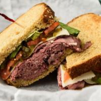 Manhattan Project · Cold rare filet of roast beef covered with horseradish cheddar cheese, pickles, sautéed onio...