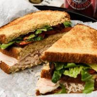 The New York Giant · A triple-decker club sandwich with Ovengold turkey breast, crisp bacon, lettuce and tomato s...