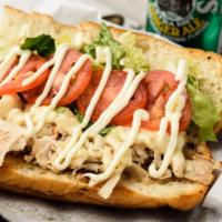 The Amy · Grilled ovengold turkey on a toasted hero roll with melted swiss cheese, lettuce, tomato, an...