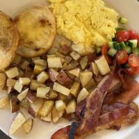 Lux Wake-Up Call · 2 eggs your way, bacon, breakfast potatoes and tomato salad.