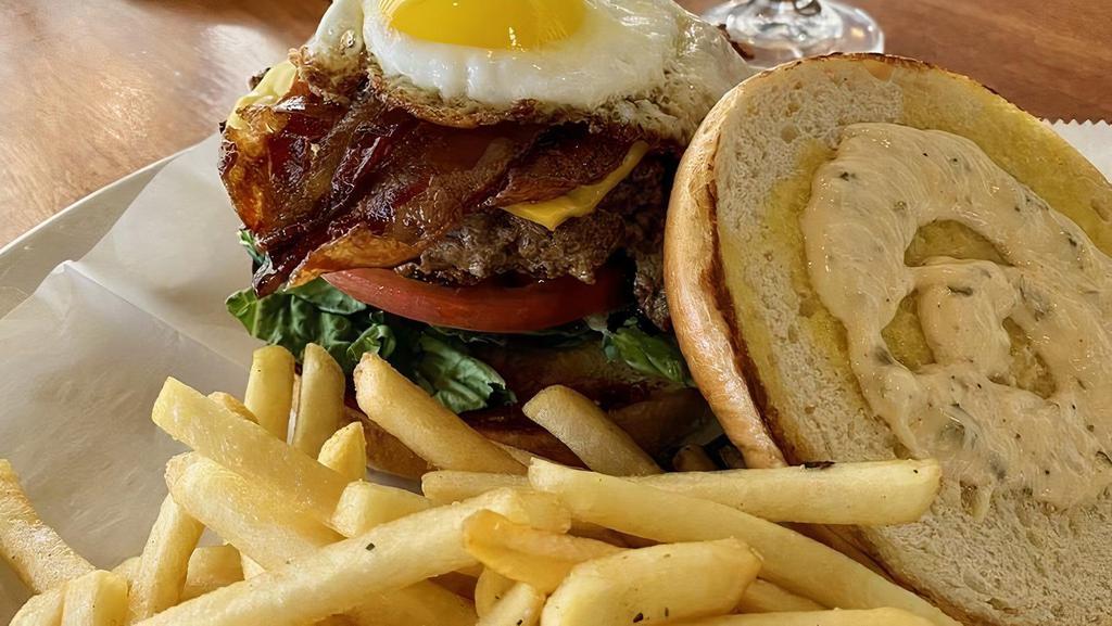 Lux Burger · 8oz fresh ground beef patty, bacon, eggs, lettuce, tomatoes, pickles, with spicy aioli on a Brioche bun.
