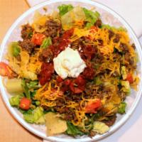 Taco Salad · Spicy. Spicy beef, onions, bell peppers, tomatoes, and cheese served over fresh lettuce and ...