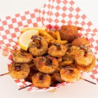 Shrimp Basket · Wild Caught Gulf Jumbos served with choice of Side & 
 two Hush Puppies.