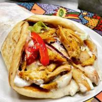 Gyro Chicken · Slow roasted chicken dressed with lettuce, tomato, onion, pickles, and ranch dressing on pit...