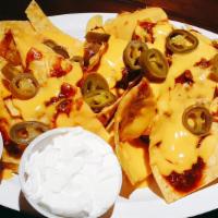 Loaded Nachos.... · Chili, cheese, jalapenos, with a side of salsa and sour cream
