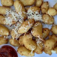 Cheese Curds · Lightly breaded cheese ourds with gooey wisconsin cheddar cheese. served with marinara sauce .