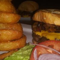 Olympic Burger* · Beef burger with cheddar cheese, opplewood bacon, crisp onion rings and bbq sauce.