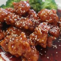 Sesame Chicken · Tender strips of marinated chicken stir fried until crispy, then cooked in tangy sesame sauce.