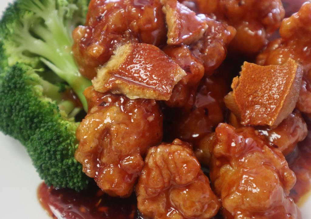 Orange Flavor Chicken · Chunks of boneless chicken, lightly breaded, deep fried, sauteed with sun-dried orange peel and broccoli in chef's special sauce. Spicy.