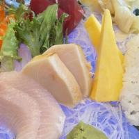 Sashimi Deluxe · Favorite. 15 pieces of raw fish, served with white rice.