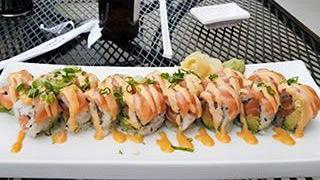 Crazy Salmon Roll · Spicy. Salmon and avocado inside. Outside with salmon, scallions and spicy mayo on top.