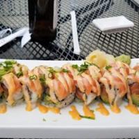 Drunken Salmon Roll · Spicy salmon, avocado, topped with seared salmon belly, sweet chilly sauce and sprout.