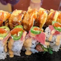 Raleigh Roll · Soft shell crab, cucumber inside, outside with spicy tuna, tempura flakes and eel sauce.