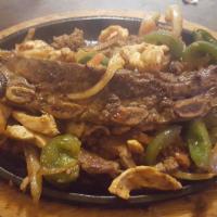Fajita Dickerson · Beef tips, chorizo, shrimp, steak, and chicken. Served with sauteed onions, tomatoes, bell p...