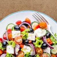 Greek Salad Getaway · House salad with crumbled feta, served with Greek vinaigrette on the side