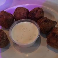Gator Balls · Six ground gator meatballs battered and fried served with ranch and a side.