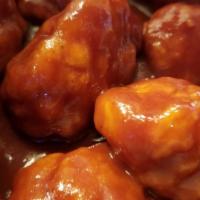 12 Boneless Wings · juicy all white meat chicken that is lightly breaded. Hand spun in your choice of sauce or p...