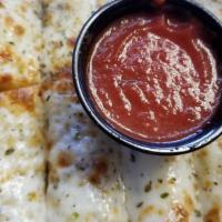 Cheesy Bread · LOAF OF HOT CHEESY BREAD WITH MARINARA SAUCE. For pepperoni lovers add: $1.59