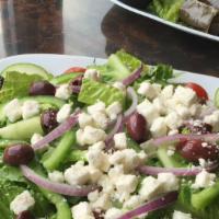 Large Greek Salad · Tomatoes, romaine, lettuce, green peppers, onions, olives and feta cheese.