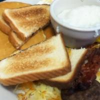 Big Dot Breakfast Platter · Two eggs, two strips of bacon, two sausage patties, two pancakes, hash browns, grits, and to...