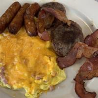 B10 Caveman Combo · Three eggs scrambled with ham and cheddar, three strips of bacon, three sausage patties.