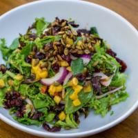 Caramelized Mango Salad · Gluten free vegetarian. mixed greens sweet and spicy mangoes marinated carnberries spiced pu...
