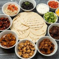 Taco Kit · Serves 3-4. Pick 2 proteins: Carnitas, chicken tinga, grilled chicken, korean pork belly, br...