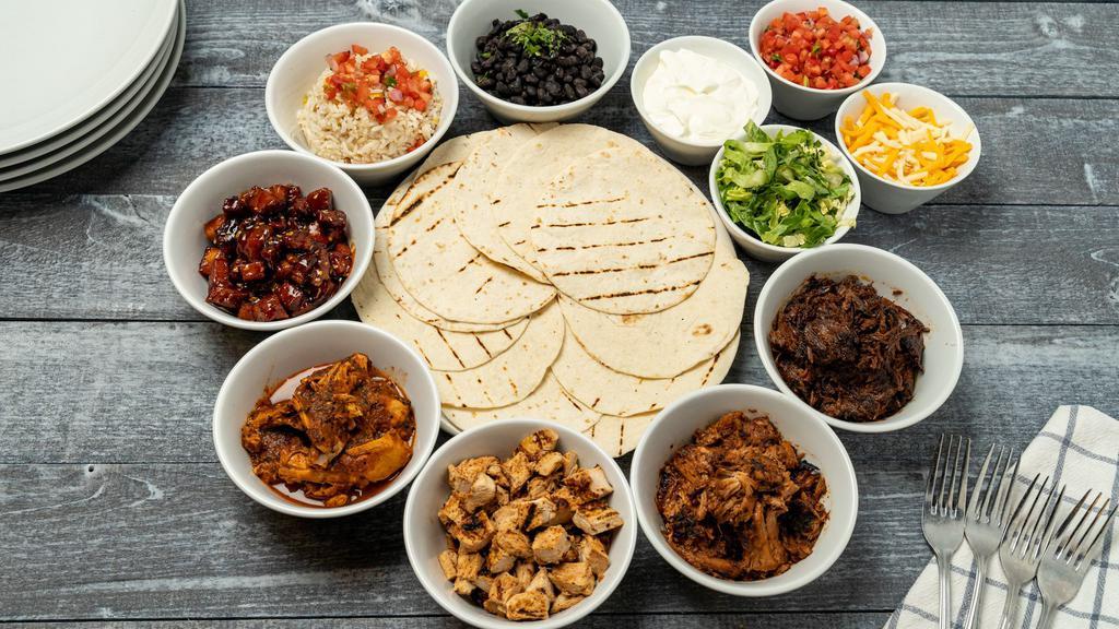 Taco Kit · Serves 3-4. Pick 2 proteins: Carnitas, chicken tinga, grilled chicken, korean pork belly, braised shortrib.
Includes cheese, lettuce, rice, beans, pico de gallo, 12 tortillas, sour cream, and chips and salsa.