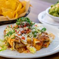 Smothered Cheese Enchiladas · Vegetarian. grilled flour tortillas sauteed onions red peppers enchilada sauce black bean-ji...