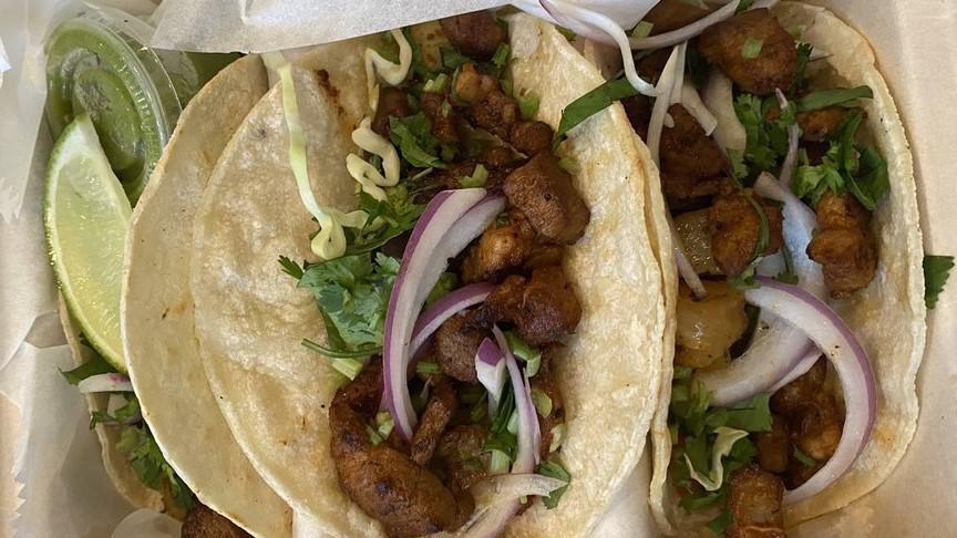 Al Pastor Tacos · Seasoned pork cooked with pineapple on soft corn tortillas with red onion and cilantro. Flour tortillas available upon request. Three pieces per order.