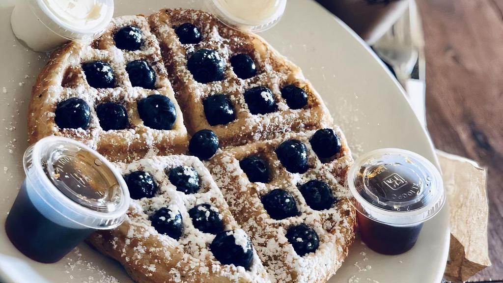 Blueberry Waffle · topped with blueberries + whipped butter + powdered sugar