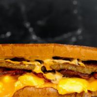 Texas Toast, Bacon, Sausage, Egg, And Cheese Sandwich · 2 scrambled eggs, melted American cheese, bacon, sausage, and Sriracha aioli on Texas toast.