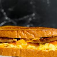 Texas Toast, Sausage, Egg, And Cheese Sandwich · 2 scrambled eggs, melted American cheese, breakfast sausage, and Sriracha aioli on Texas toa...