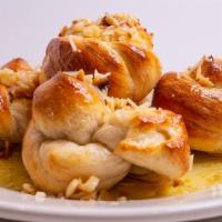 Garlic Knots · Vegetarian. 5 Fresh dough knots, tied and baked to order then tossed in extra virgin olive o...