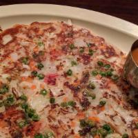 Onion & Peas Uthappam · Vegetarian. Topped with onion and peas.