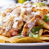 Fajita Nachos ⭐️ · Nachos piled high with your choice of chicken or steak grilled with tomatoes, onions, and gr...