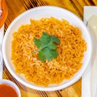 Rice · Traditional mexican rice made with chicken stock onion garlic tomato pepper and lots of love.