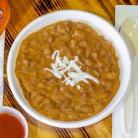 Fried Beans · Refried pinto beans made with grandmas traditional recipe.
