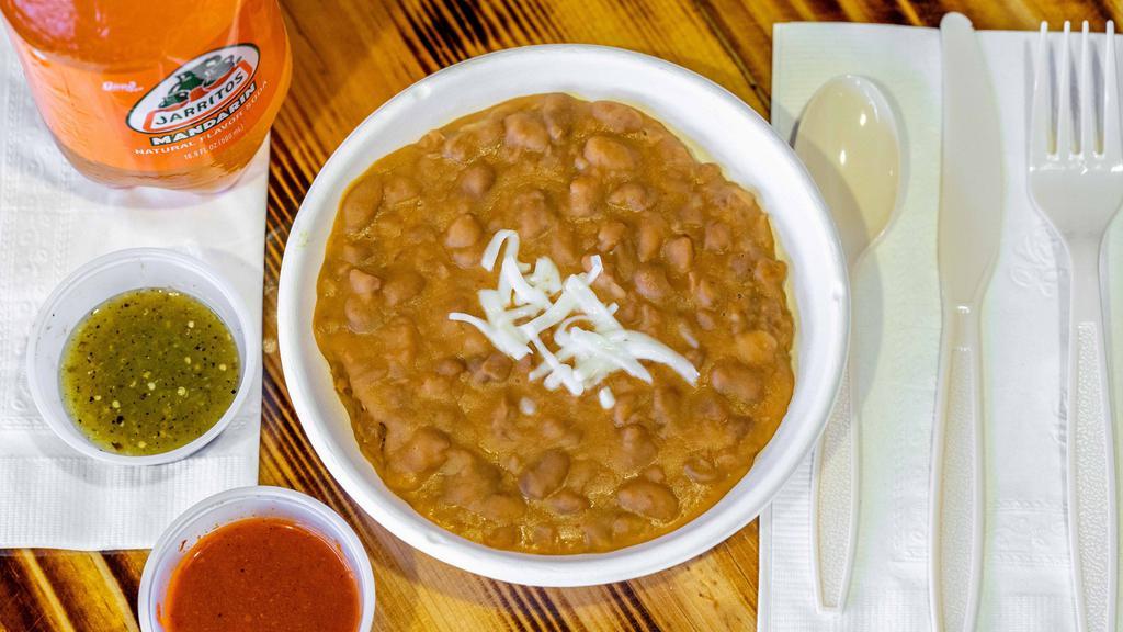Fried Beans · Refried pinto beans made with grandmas traditional recipe.