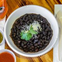 Black Beans · Home made baked black beans with our signature spice blend roasted garlic cilantro onion lig...